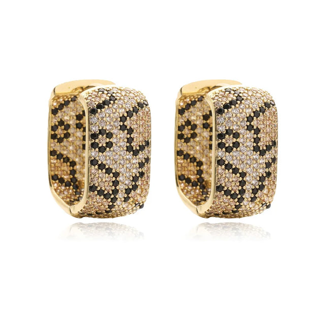 Gold and silver textured hoop earrings, ideal for jewelry cleaning, jewelry storage, jewelry websites, and showcasing luxurious designs by top jewelry designers.
