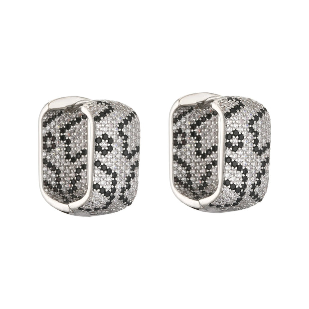 Gold and silver textured hoop earrings, ideal for jewelry cleaning, jewelry storage, jewelry websites, and showcasing luxurious designs by top jewelry designers.