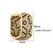 Gold and silver textured hoop earrings, ideal for jewelry cleaning, jewelry storage, jewelry websites, and showcasing luxurious designs by top jewelry designers.