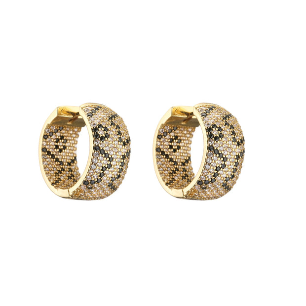 Gold and silver textured hoop earrings, ideal for jewelry cleaning, jewelry storage, jewelry websites, and showcasing luxurious designs by top jewelry designers.