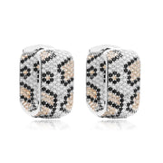 Gold and silver textured hoop earrings, ideal for jewelry cleaning, jewelry storage, jewelry websites, and showcasing luxurious designs by top jewelry designers.
