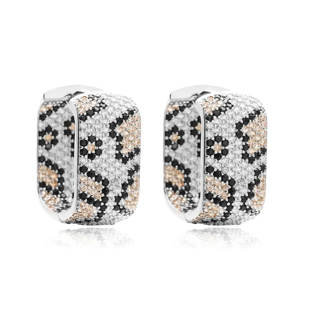 Gold and silver textured hoop earrings, ideal for jewelry cleaning, jewelry storage, jewelry websites, and showcasing luxurious designs by top jewelry designers.