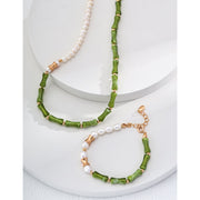 Elegant green bamboo and pearl bracelet with gold accents on a jewelry case, ideal for jewelry storage. Discover unique jewelry designs and jewelry websites for custom pieces like permanent jewelry, gem jewelry, and turquoise jewelry. Perfect for mature women with sophisticated tastes, this vintage jewelry also makes a great gift for mom. Explore jewelry repair close to you, jewelry with engraving, and earrings piercing options. Jewelry brands like Jewelry Unlimited offer beautiful, customizable jewelry suc
