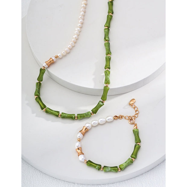 Elegant green bamboo and pearl bracelet with gold accents on a jewelry case, ideal for jewelry storage. Discover unique jewelry designs and jewelry websites for custom pieces like permanent jewelry, gem jewelry, and turquoise jewelry. Perfect for mature women with sophisticated tastes, this vintage jewelry also makes a great gift for mom. Explore jewelry repair close to you, jewelry with engraving, and earrings piercing options. Jewelry brands like Jewelry Unlimited offer beautiful, customizable jewelry suc