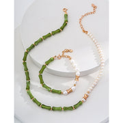 Elegant green bamboo and pearl bracelet with gold accents on a jewelry case, ideal for jewelry storage. Discover unique jewelry designs and jewelry websites for custom pieces like permanent jewelry, gem jewelry, and turquoise jewelry. Perfect for mature women with sophisticated tastes, this vintage jewelry also makes a great gift for mom. Explore jewelry repair close to you, jewelry with engraving, and earrings piercing options. Jewelry brands like Jewelry Unlimited offer beautiful, customizable jewelry suc