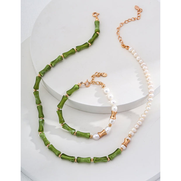 Elegant green bamboo and pearl bracelet with gold accents on a jewelry case, ideal for jewelry storage. Discover unique jewelry designs and jewelry websites for custom pieces like permanent jewelry, gem jewelry, and turquoise jewelry. Perfect for mature women with sophisticated tastes, this vintage jewelry also makes a great gift for mom. Explore jewelry repair close to you, jewelry with engraving, and earrings piercing options. Jewelry brands like Jewelry Unlimited offer beautiful, customizable jewelry suc