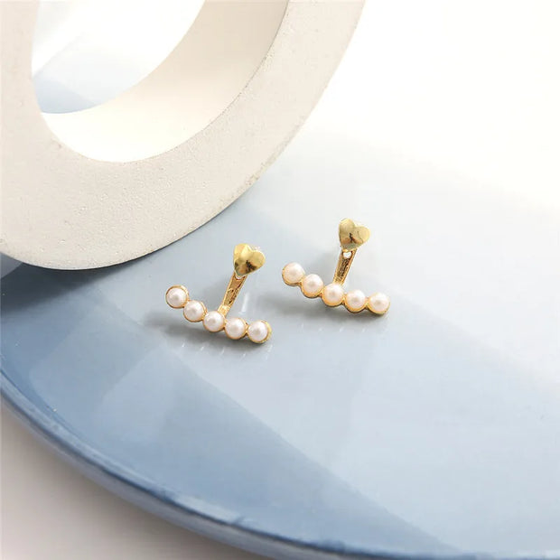 Heart-shaped pearl earrings for jewelry cleaning, earrings piercing, and jewelry storage. Perfect for jewelry designers, vintage jewelry, and jewelry for mom gifts.