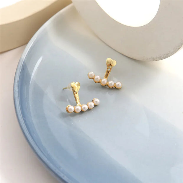 Heart-shaped pearl earrings for jewelry cleaning, earrings piercing, and jewelry storage. Perfect for jewelry designers, vintage jewelry, and jewelry for mom gifts.