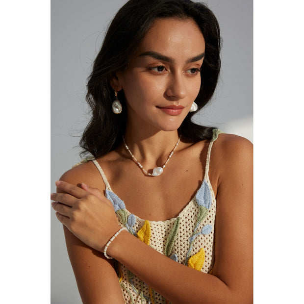 Elegant pearl drop earrings in gold and silver, ideal for jewelry storage, designed by top jewelry designers, perfect for vintage jewelry enthusiasts, earrings piercing styles, or pairing with turquoise jewelry, gem jewelry, or emerald ring jewelry.