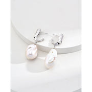 Elegant pearl drop earrings in gold and silver, ideal for jewelry storage, designed by top jewelry designers, perfect for vintage jewelry enthusiasts, earrings piercing styles, or pairing with turquoise jewelry, gem jewelry, or emerald ring jewelry.