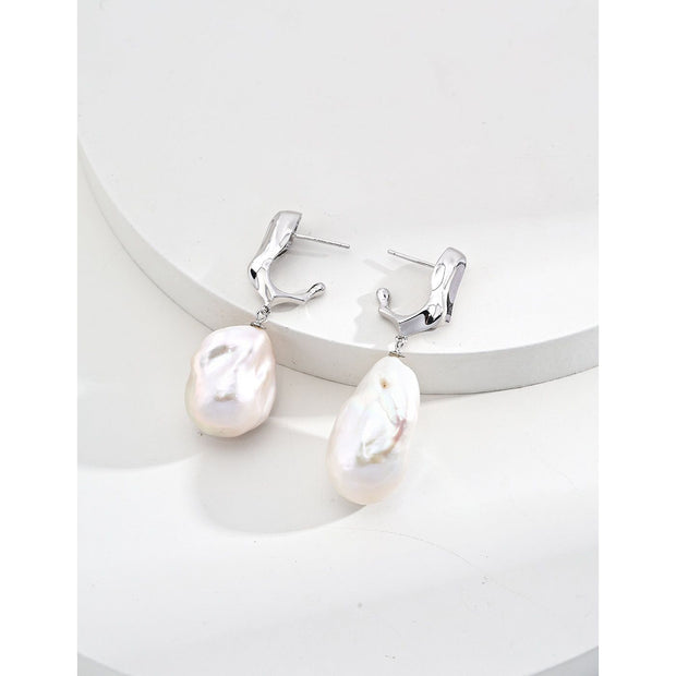 Elegant pearl drop earrings in gold and silver, ideal for jewelry storage, designed by top jewelry designers, perfect for vintage jewelry enthusiasts, earrings piercing styles, or pairing with turquoise jewelry, gem jewelry, or emerald ring jewelry.