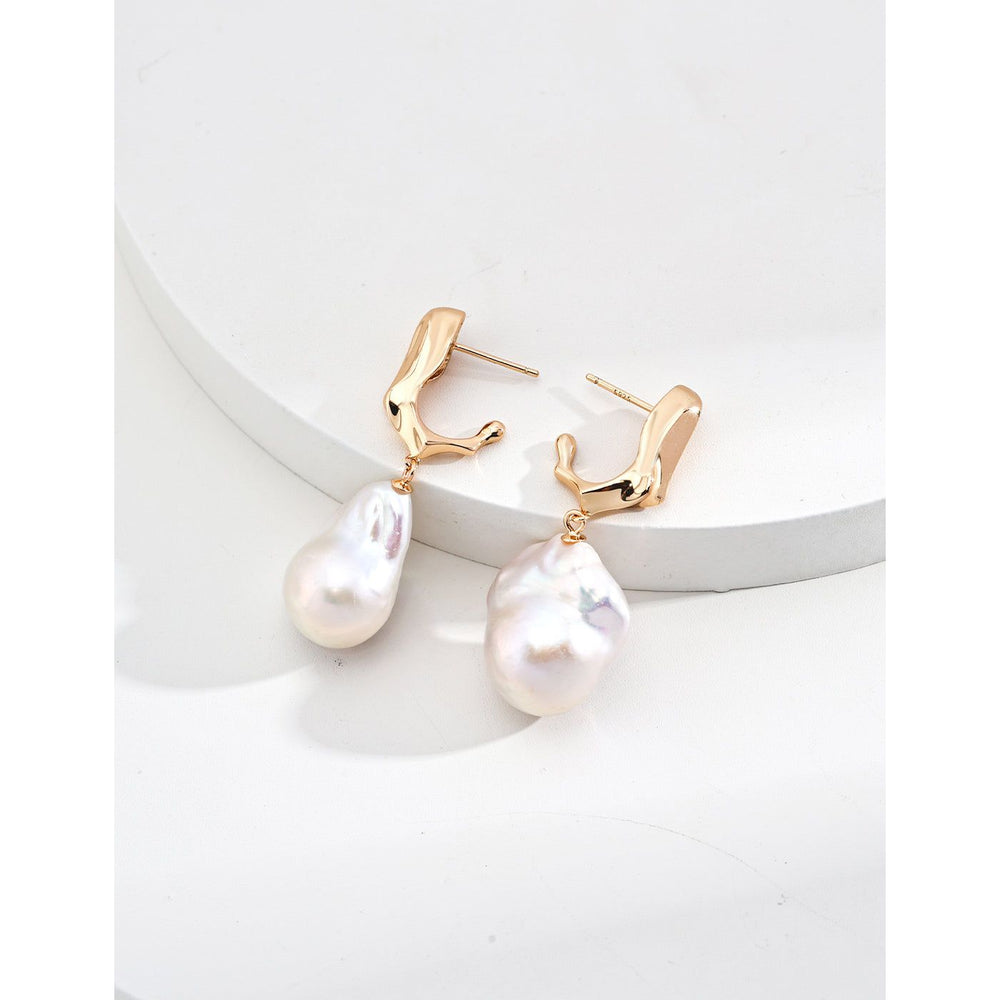 Elegant pearl drop earrings in gold and silver, ideal for jewelry storage, designed by top jewelry designers, perfect for vintage jewelry enthusiasts, earrings piercing styles, or pairing with turquoise jewelry, gem jewelry, or emerald ring jewelry.
