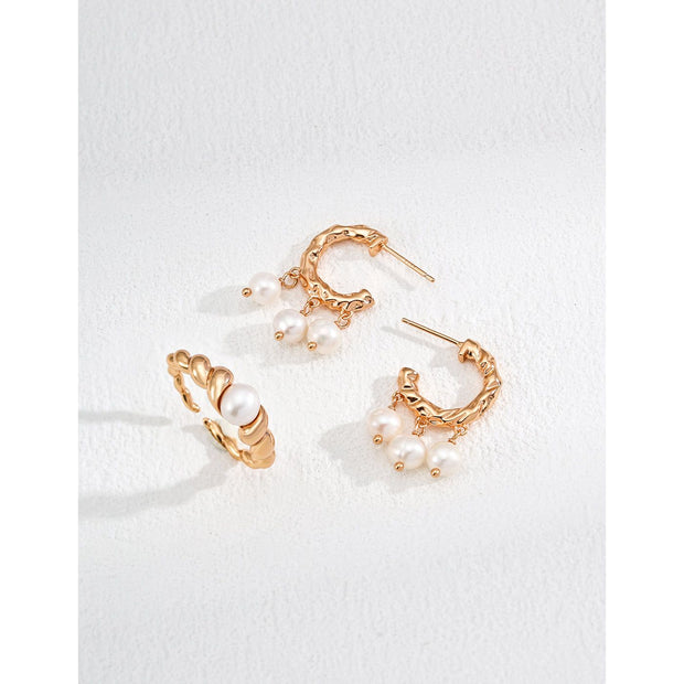 Elegant gold and silver hoop earrings with dangling pearls, perfect for jewelry storage, earrings piercing, and vintage jewelry lovers. Great for jewelry websites and jewelry for mom gifts.