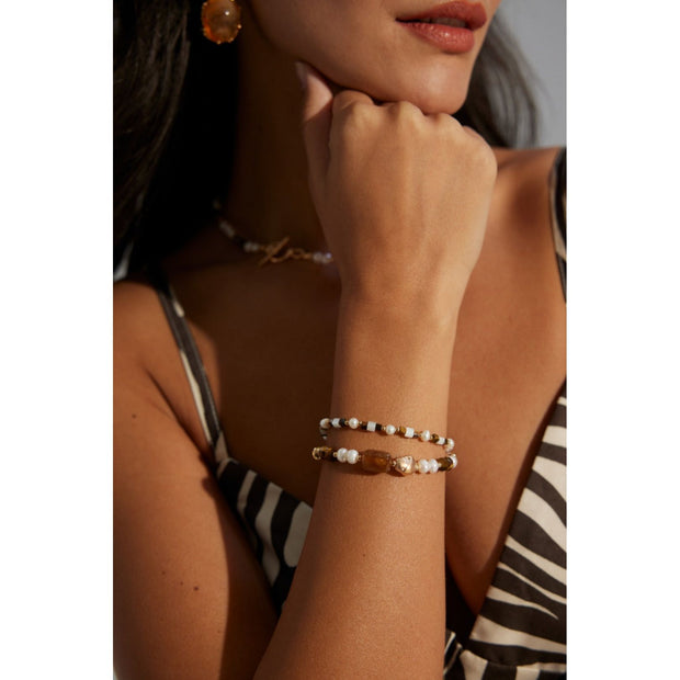 Elegant pearl and bead bracelet with gold accents, ideal for jewelry storage, jewelry designers, and jewelry websites. Perfect for vintage jewelry collections or jewelry for mom.