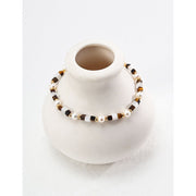 Elegant pearl and bead bracelet with gold accents, ideal for jewelry storage, jewelry designers, and jewelry websites. Perfect for vintage jewelry collections or jewelry for mom.
