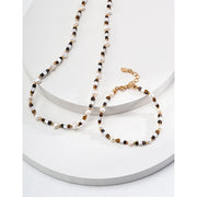 Elegant pearl and bead bracelet with gold accents, ideal for jewelry storage, jewelry designers, and jewelry websites. Perfect for vintage jewelry collections or jewelry for mom.