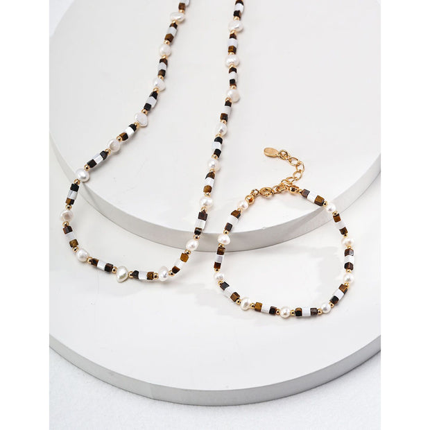 Elegant pearl and bead bracelet with gold accents, ideal for jewelry storage, jewelry designers, and jewelry websites. Perfect for vintage jewelry collections or jewelry for mom.
