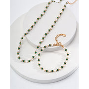 Elegant pearl and green crystal bracelet with gold chain, perfect for jewelry storage in a jewelry case. A timeless design for jewelry websites and jewelry lovers, offering classic beauty for mature women hairstyles. Ideal for earrings and rings collections, this jewelry features turquoise accents and a vintage touch. Perfect for jewelry repair close to me or for adding to a jewelry for mom collection. With gemstones like turquoise and emerald, this is a stunning piece for those looking for permanent jewelr