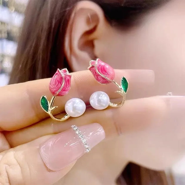 Flower and pearl stud earrings with pink petals, green leaves, and gold accents, perfect for jewelry websites, jewelry storage, vintage jewelry, and gifting for mom.