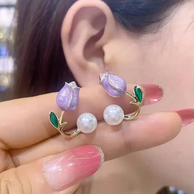 Flower and pearl stud earrings with pink petals, green leaves, and gold accents, perfect for jewelry websites, jewelry storage, vintage jewelry, and gifting for mom.