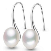Elegant silver drop earrings with luminous freshwater pearls, ideal for earrings piercing, jewelry storage, vintage jewelry collections, and gifting. Perfect for jewelry websites or body jewelry enthusiasts.
