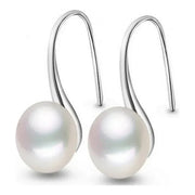 Elegant silver drop earrings with luminous freshwater pearls, ideal for earrings piercing, jewelry storage, vintage jewelry collections, and gifting. Perfect for jewelry websites or body jewelry enthusiasts.
