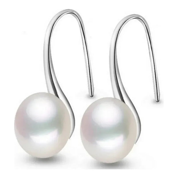 Elegant silver drop earrings with luminous freshwater pearls, ideal for earrings piercing, jewelry storage, vintage jewelry collections, and gifting. Perfect for jewelry websites or body jewelry enthusiasts.