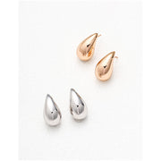 Teardrop stud earrings in rose gold and silver, perfect for jewelry storage, earrings piercing, and jewelry websites. Elegant design for body jewelry lovers and jewelry designers.