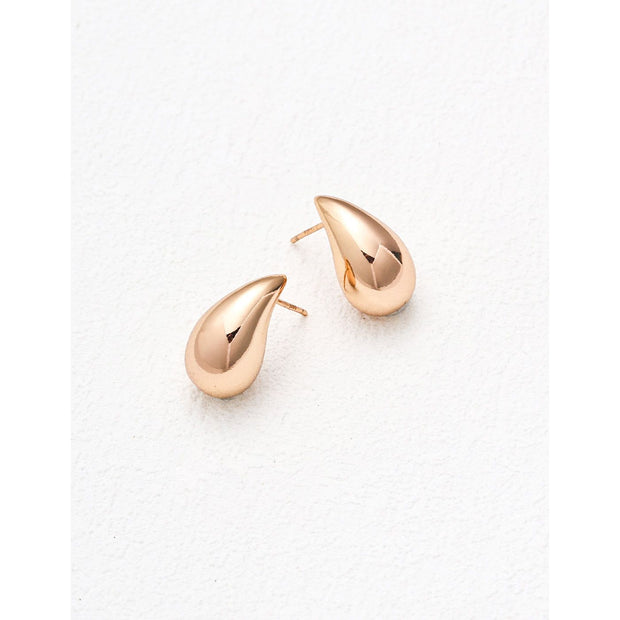 Teardrop stud earrings in rose gold and silver, perfect for jewelry storage, earrings piercing, and jewelry websites. Elegant design for body jewelry lovers and jewelry designers.
