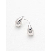 Teardrop stud earrings in rose gold and silver, perfect for jewelry storage, earrings piercing, and jewelry websites. Elegant design for body jewelry lovers and jewelry designers.