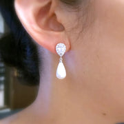 Elegant teardrop earrings with zirconia and pearls, perfect for jewelry storage, jewelry cleaning tips, or showcasing on jewelry websites for mature women hairstyles or body jewelry lovers.