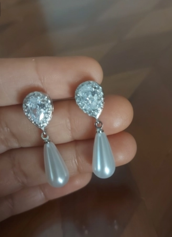 Elegant teardrop earrings with zirconia and pearls, perfect for jewelry storage, jewelry cleaning tips, or showcasing on jewelry websites for mature women hairstyles or body jewelry lovers.