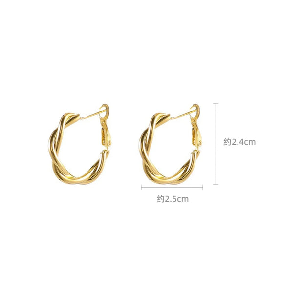 Elegant twisted gold hoop earrings for body jewelry enthusiasts, perfect for jewelry storage in a jewelry case. Ideal for mature women hairstyles or earrings piercing, these earrings rings are a timeless choice for jewelry websites and jewelry designers. Great gift idea for mom or vintage jewelry collectors. Discover the beauty of diamond and jewelry with this versatile accessory