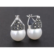 Elegant vintage pearl drop earrings with marcasite detailing, perfect for jewelry storage, jewelry websites, jewelry cleaning, and timeless vintage jewelry collections.