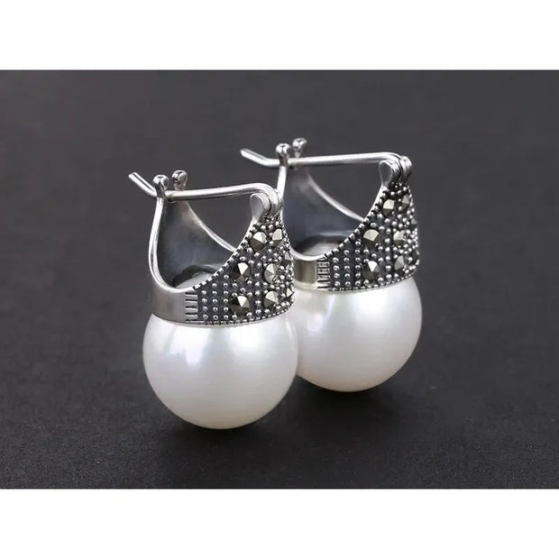 Elegant vintage pearl drop earrings with marcasite detailing, perfect for jewelry storage, jewelry websites, jewelry cleaning, and timeless vintage jewelry collections.