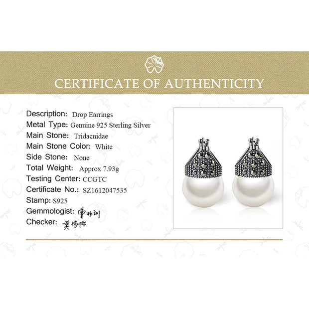 Elegant vintage pearl drop earrings with marcasite detailing, perfect for jewelry storage, jewelry websites, jewelry cleaning, and timeless vintage jewelry collections.