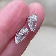 Pear-cut diamond earrings with sparkling stones, crafted by expert jewelry designers, ideal for display on jewelry websites or storage in a jewelry case.