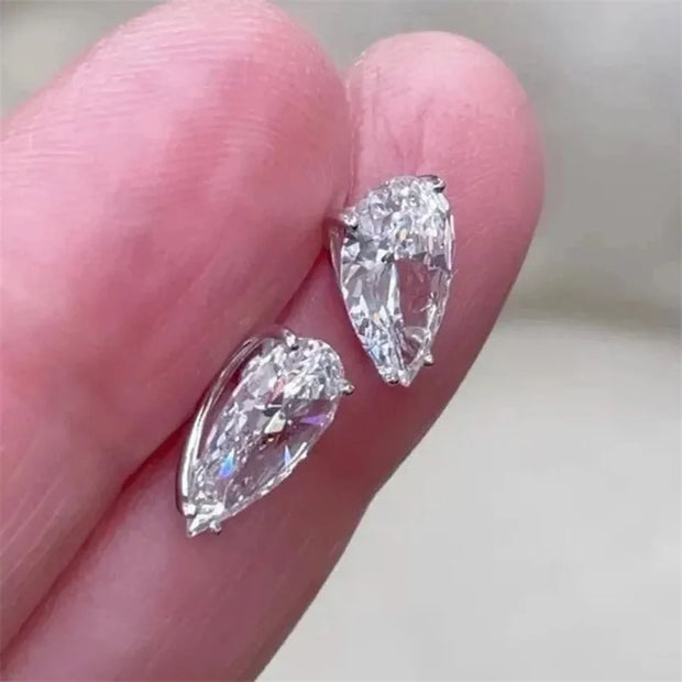 Pear-cut diamond earrings with sparkling stones, crafted by expert jewelry designers, ideal for display on jewelry websites or storage in a jewelry case.