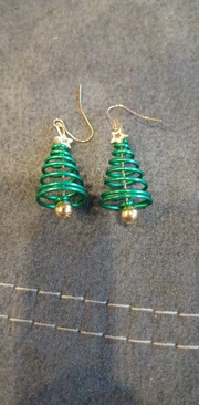 Festive Christmas tree earrings with green spirals and gold accents, perfect for jewelry websites, earrings piercing, jewelry storage, and holiday gifting.