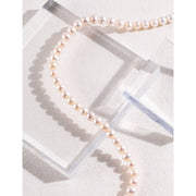 Elegant gold-accented pearl necklace on an acrylic stand, ideal for jewelry storage or display. Perfect for jewelry designers, vintage jewelry lovers, or gem jewelry enthusiasts. Great addition to jewelry cases, with timeless appeal for mature women hairstyles or pairing with earrings rings. Shop on top jewelry websites or find jewelry repair close to me for maintenance.
