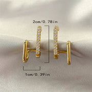 Gold double hoop earrings with crystals, perfect for jewelry websites, jewelry storage, diamond and jewelry collections, and pairing with mature women hairstyles.