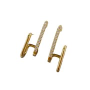 Gold double hoop earrings with crystals, perfect for jewelry websites, jewelry storage, diamond and jewelry collections, and pairing with mature women hairstyles.