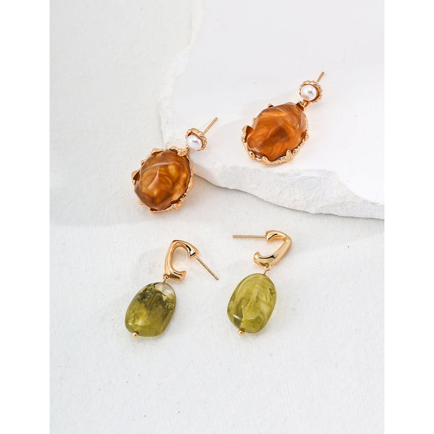 Gold drop earrings with amber stones and pearls, perfect for vintage jewelry lovers, jewelry designers, and jewelry storage ideas on top jewelry websites.