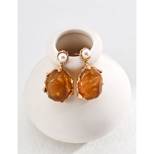 Gold drop earrings with amber stones and pearls, perfect for vintage jewelry lovers, jewelry designers, and jewelry storage ideas on top jewelry websites.