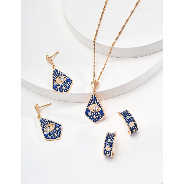 Gold drop earrings with bold blue enamel design, crystal accents, and eye motif, perfect for jewelry storage, designed by top jewelry designers. Ideal for earrings piercing, vintage jewelry collections, jewelry for mom, body jewelry, and gem jewelry. A standout piece for jewelry websites and cases.
