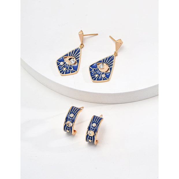 Gold drop earrings with bold blue enamel design, crystal accents, and eye motif, perfect for jewelry storage, designed by top jewelry designers. Ideal for earrings piercing, vintage jewelry collections, jewelry for mom, body jewelry, and gem jewelry. A standout piece for jewelry websites and cases.