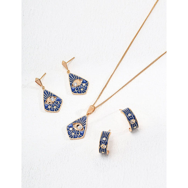 Gold drop earrings with bold blue enamel design, crystal accents, and eye motif, perfect for jewelry storage, designed by top jewelry designers. Ideal for earrings piercing, vintage jewelry collections, jewelry for mom, body jewelry, and gem jewelry. A standout piece for jewelry websites and cases.