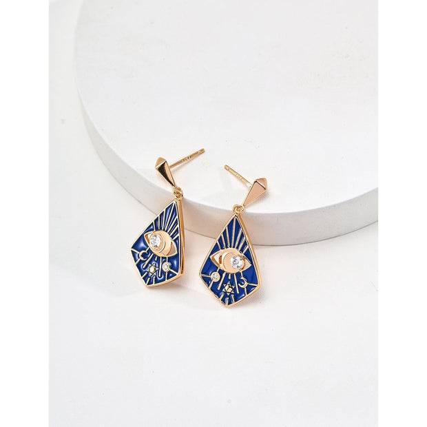 Gold drop earrings with bold blue enamel design, crystal accents, and eye motif, perfect for jewelry storage, designed by top jewelry designers. Ideal for earrings piercing, vintage jewelry collections, jewelry for mom, body jewelry, and gem jewelry. A standout piece for jewelry websites and cases.