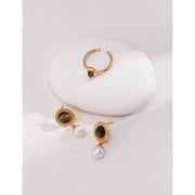 Gold drop earrings with tiger eye gemstones and pearl accents, perfect for vintage jewelry, jewelry storage, jewelry websites, and elegant jewelry for mom.