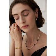 Gold drop earrings with tiger eye gemstones and pearl accents, perfect for vintage jewelry, jewelry storage, jewelry websites, and elegant jewelry for mom.